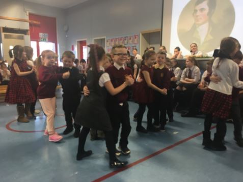 Boys and girls dancing